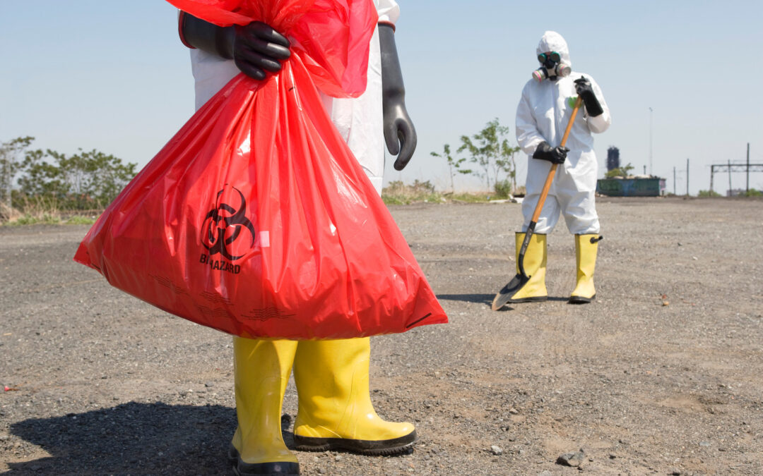 worker collecting hazardous waste disposal in Surrey